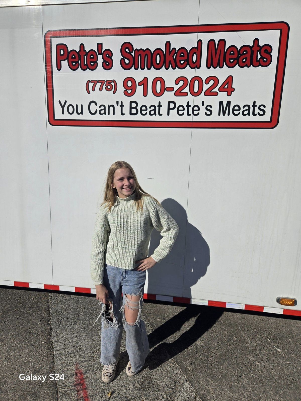 Avery with a local business that sponsored the bike drive (photo 8)